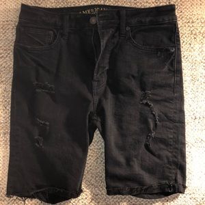 Black jean shorts with rips